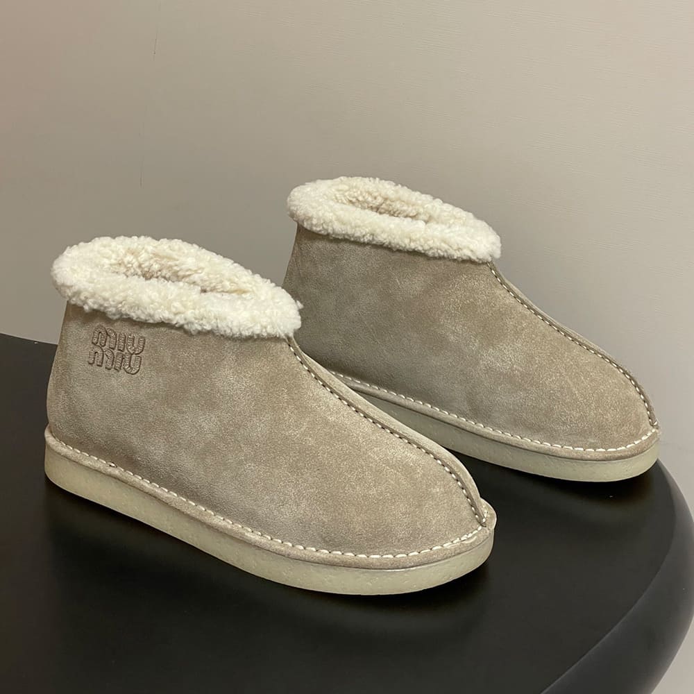 M1um1u Suede and shearling slip-on booties