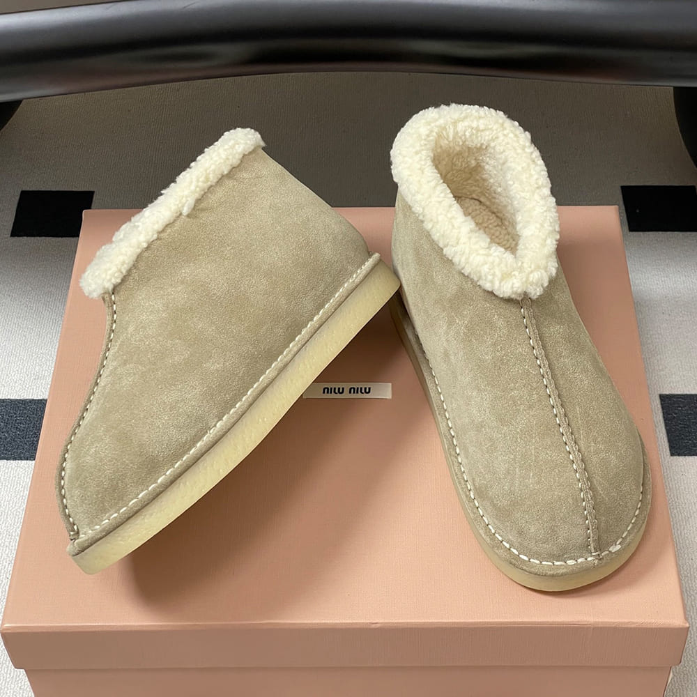 M1um1u Suede and shearling slip-on booties